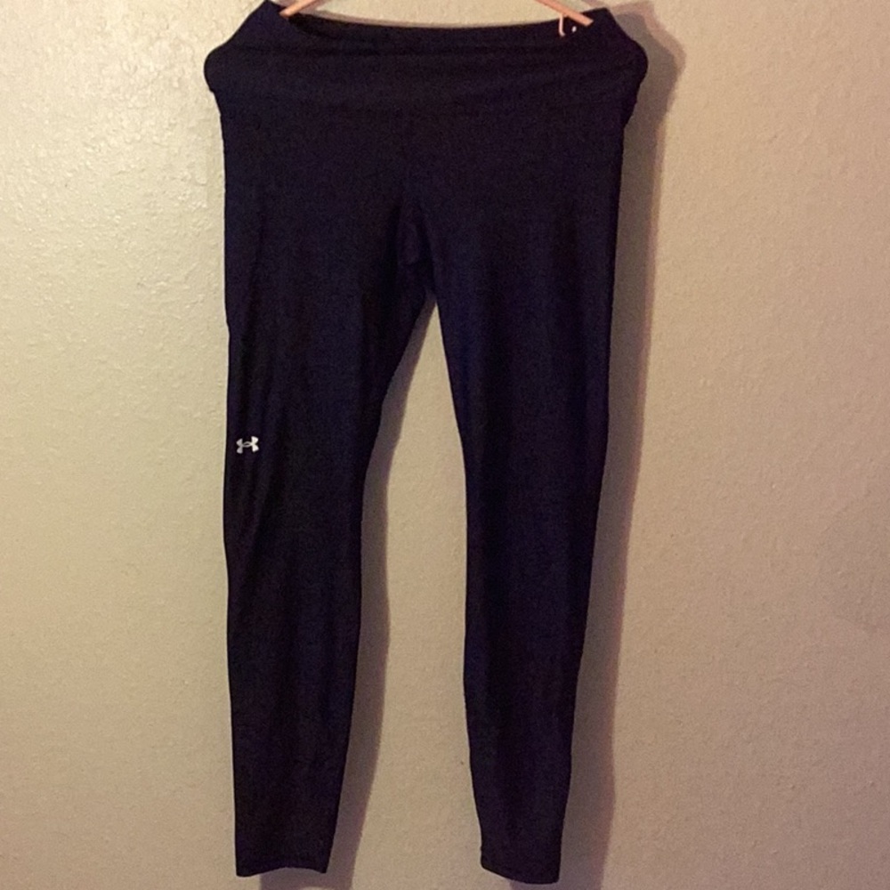 Under Armour leggings with a side pocket. Size medium.